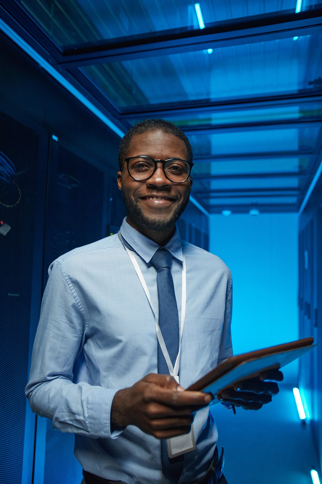 Smiling IT Engineer in Data Center